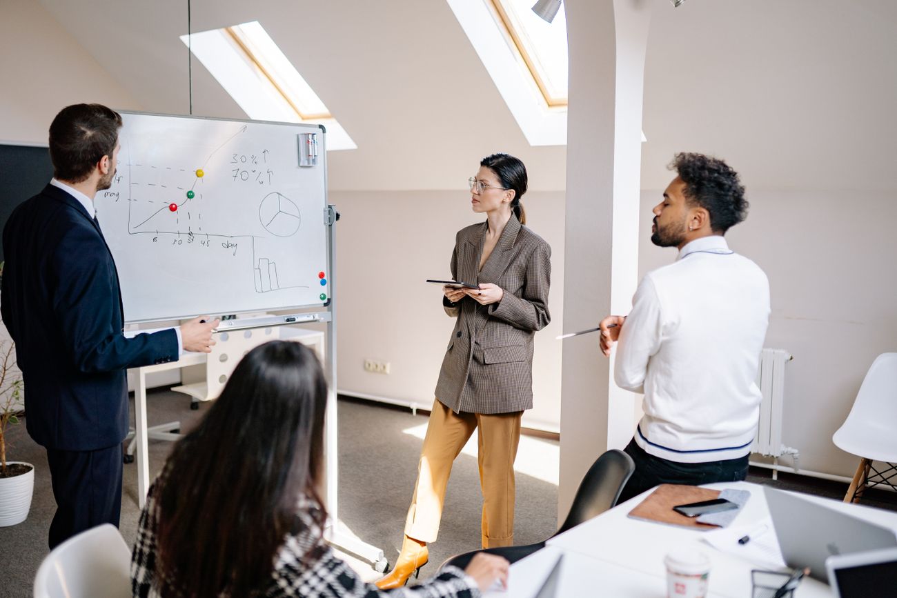 A team reviewing strategy together around a table